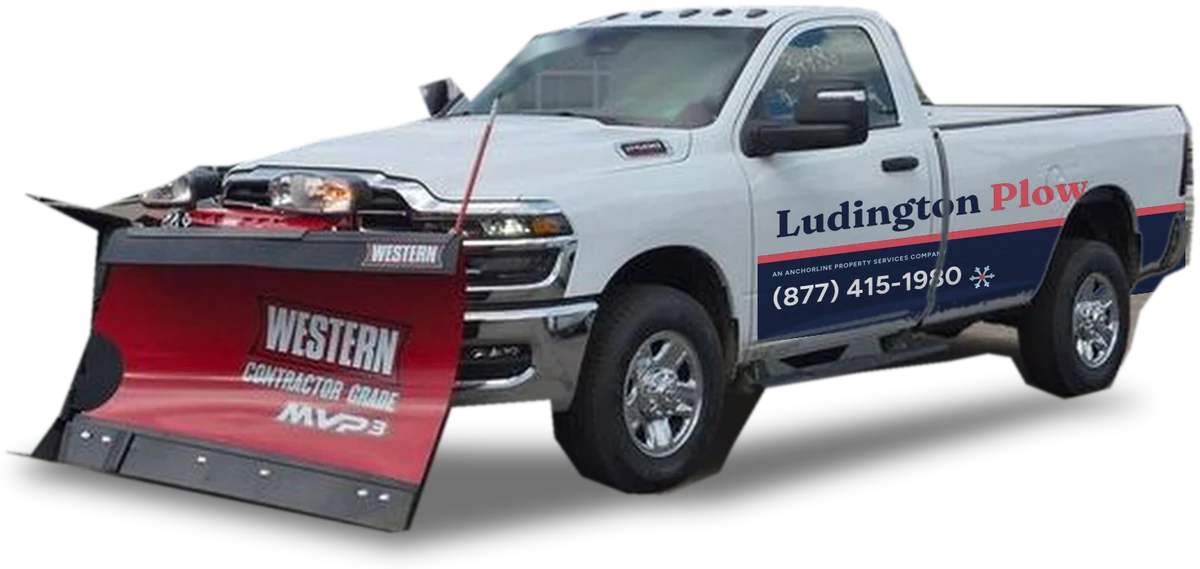 Ludington Plow truck with a V-plow, wrapped in Ludington Plow branding